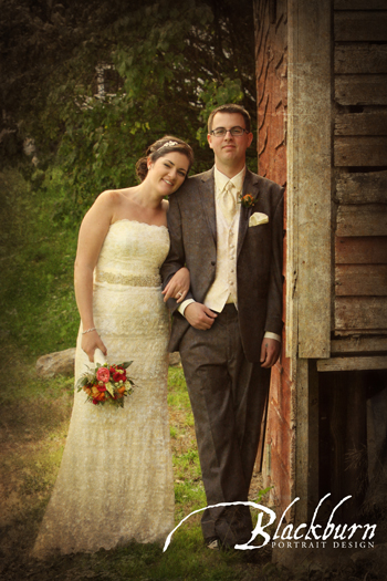 Bride and Groom leaning against a rustic barn in the Fall in Saratoga NY