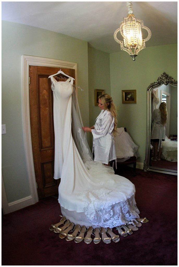 Bridal Boudoir of Ashley Getting Ready with Wedding Dress at Saratoga Mansion in Bridal Suite