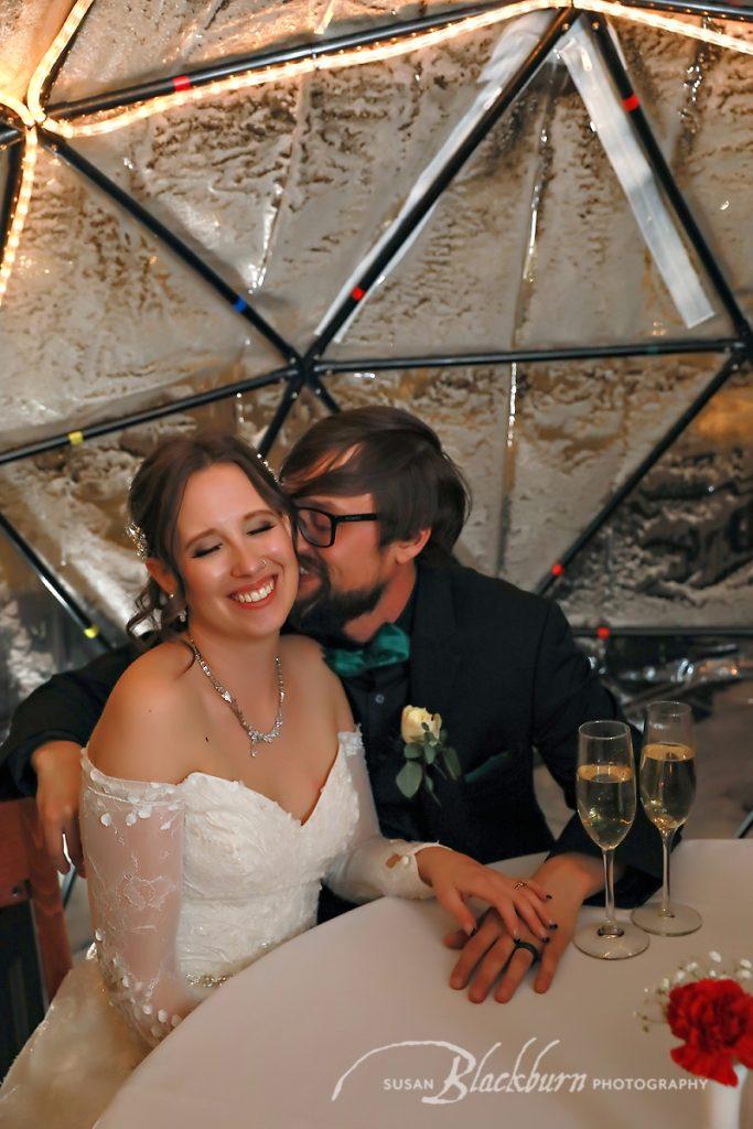 Winter Wedding Photo in an igloo at the Queensbury Hotel in Glens Falls