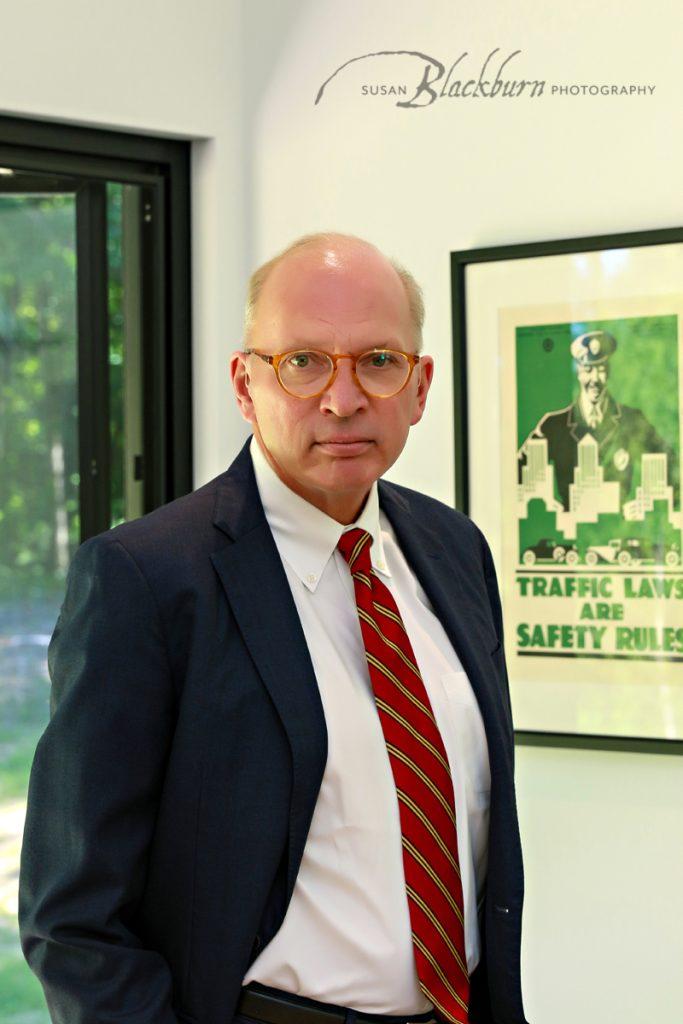 Eye Catching Headshot of a Personal Injury Lawyer in his office